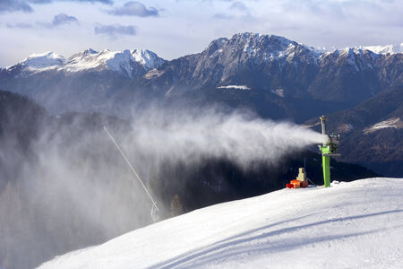Snow cannon, artifical snow powder making on the ski slopeの写真素材