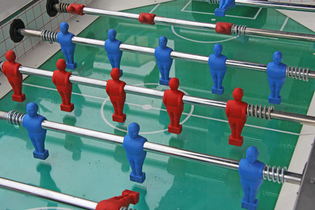 Close up of Soccer table game with blue and red players