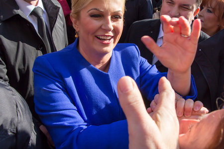 ZAGREB, CROATIA - FEBRUARY 15: Kolinda Grabar Kitarovic the first woman President of Croatia, through the crowd of people, is coming to the inauguration at St. Mark's Square, on February 15, 2015 in Zagreb.のeditorial素材