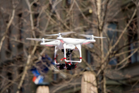 Radio controlled quadcopter drone flying in the city