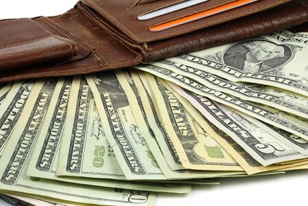 A bundle of Dollar banknotes in a brown leather walletの写真素材