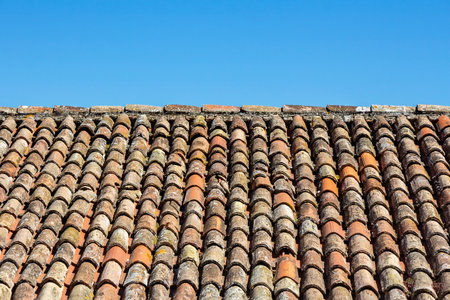 Traditional old roof tiles on Mediterranean houses, as texture backgroundの写真素材