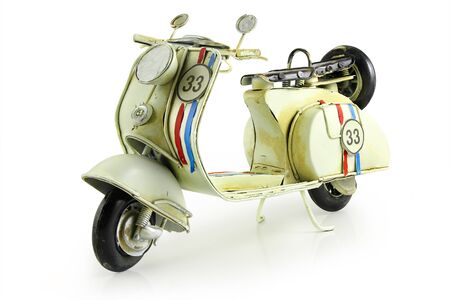 Old retro toy motorcycle isolated on white backgroundの写真素材