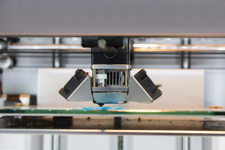 Three dimensional printer, Printing with blue Plastic Wireの写真素材