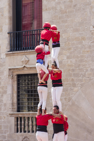 BARCELONA, SPAIN - JUNE 26, 2016: Castellers group of people that build human castles on June 26, 2016 in Barcelona.  Castles is a Human Tower traditional festivities in Catalonia Spain.のeditorial素材