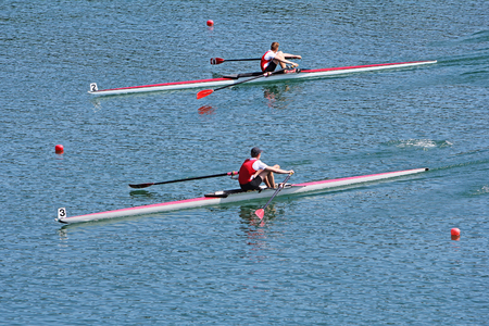 Rowers in a rowing boat on the race
の写真素材