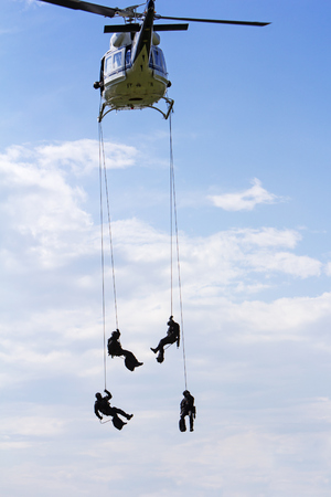 Special forces in helicopter with blue sky on background
の写真素材