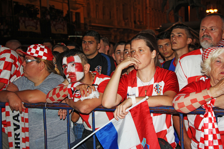 ZAGREB, CROATIA - JULY 07 Croatian football fans on the Ban Jelacic Square, watching 2018 FIFA WORLD CUP RUSSIA match Russia vs Croatia on July 07, 2018 in Zagreb, Croatiaのeditorial素材
