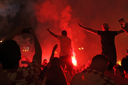 ZAGREB, CROATIA - JULY 07 Croatian football fans on the Ban Jelacic Square, watching 2018 FIFA WORLD CUP RUSSIA match Russia vs Croatia on July 07, 2018 in Zagreb, Croatiaのeditorial素材