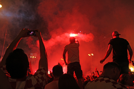 ZAGREB, CROATIA - JULY 07 Croatian football fans on the Ban Jelacic Square, watching 2018 FIFA WORLD CUP RUSSIA match Russia vs Croatia on July 07, 2018 in Zagreb, Croatiaのeditorial素材
