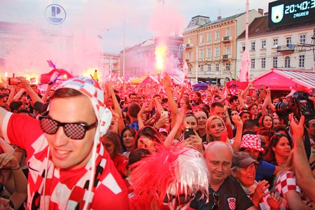 ZAGREB, CROATIA - JULY 07 Croatian football fans on the Ban Jelacic Square, watching 2018 FIFA WORLD CUP RUSSIA match Russia vs Croatia on July 07, 2018 in Zagreb, Croatiaのeditorial素材