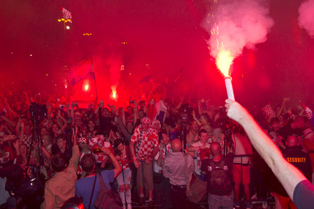 ZAGREB, CROATIA - JULY 11 Croatian football fans on the Ban Jelacic Square, watching 2018 FIFA WORLD CUP RUSSIA match Croatia vs England on July 11, 2018 in Zagreb, Croatiaのeditorial素材