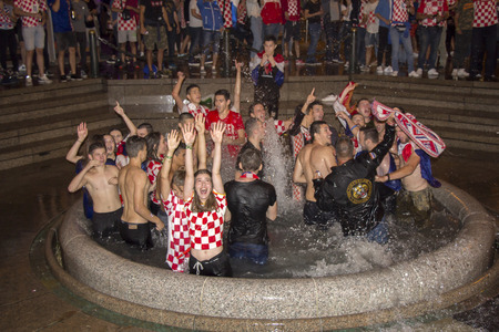 ZAGREB, CROATIA - JULY 11 Croatian football fans after the match of Croatia vs England 2018 FIFA WORLD CUP RUSSIA in the fountains of ManduÅ¡evac on Ban Josip JelaÄiÄ square on July 11, 2018 in Zagreb, Croatiaのeditorial素材