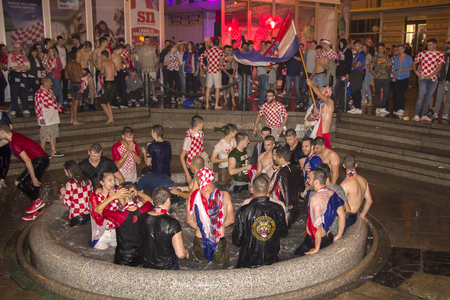 ZAGREB, CROATIA - JULY 11 Croatian football fans after the match of Croatia vs England 2018 FIFA WORLD CUP RUSSIA in the fountains of ManduÅ¡evac on Ban Josip JelaÄiÄ square on July 11, 2018 in Zagreb, Croatiaのeditorial素材
