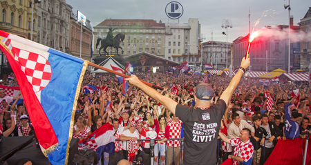 ZAGREB, CROATIA - JULY 11 Croatian football fans on the Ban Jelacic Square, watching 2018 FIFA WORLD CUP RUSSIA match Croatia vs England on July 11, 2018 in Zagreb, Croatiaのeditorial素材