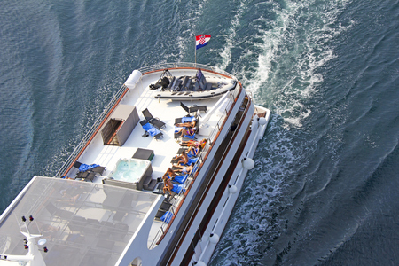Small cruise ship sailing across the Adriatic Sea - Air photographyの写真素材