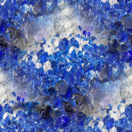 Many broken pieces of glass in white and blue, as seamless backgroundの写真素材