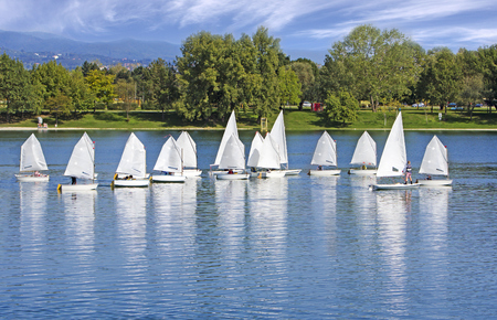 The small sailing ships regatta on the blue lakeの写真素材