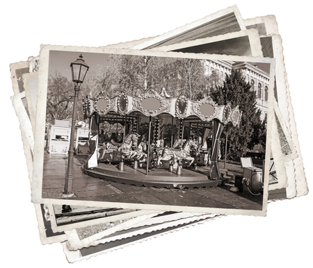 Old fashioned french carousel with horses Stack of old photosの写真素材