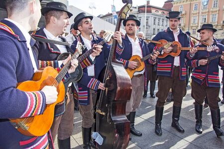 ZAGREB, CROATIA - FEBRUARY 15, 2019: Croatian musicians in traditional Slavonian costumes, play on Ban Jelacic Square in Zagreb, Croatia.のeditorial素材