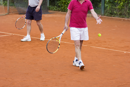 Doubles tennis player with partner in the backgroundの写真素材