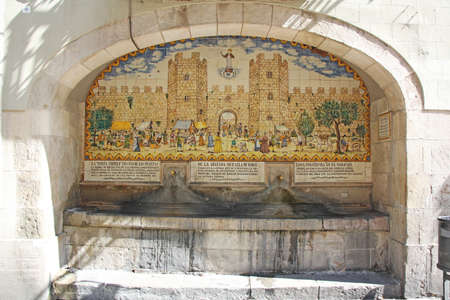 Old vintage small fountain in barcelonaの写真素材