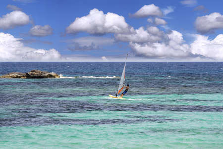 Windsurfing on sea and blue sky backgroundの写真素材