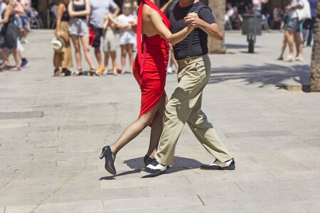 Street couple dancers performing Argentine tango danceの写真素材