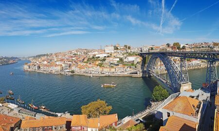 Panoramic view of old town Porto and Douro River with traditional Rabelo boats.の写真素材