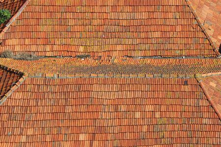 Background of a roof with old roof tilesの写真素材