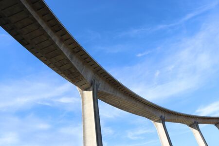 View of concrete road curve of viaduct whit blue sky backgroundの写真素材
