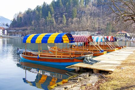 Traditional wooden boats on Lake Bled in Sloveniaの写真素材