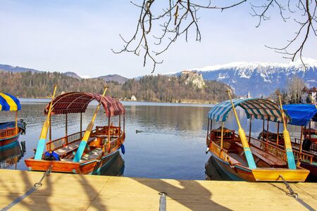 Traditional wooden boats on Lake Bled in Sloveniaの写真素材