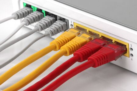 Wireless Modem router with  network hub with cables connectingの写真素材