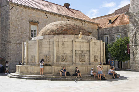 Dubrovnik, Croatia - September 01, 2020: Many tourists near the big Onfrio fountain with waterのeditorial素材