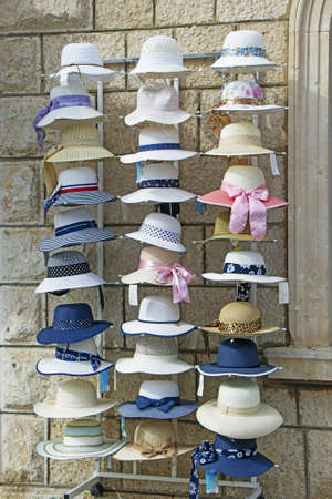 A lot of various women's hats in the street shopの写真素材
