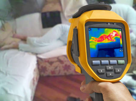 Recording with thermal camera Young woman is lying on the bedの写真素材
