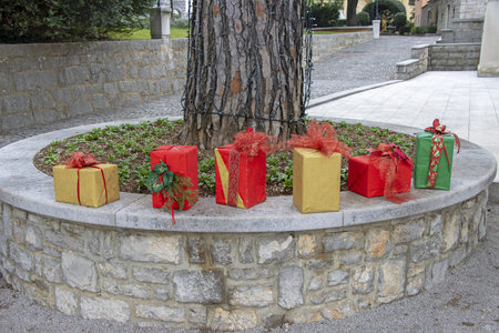 Christmas decorations with Christmas gift boxes in a city parkの写真素材