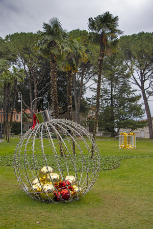 Christmas decoration as big Christmas ball in a city parkの写真素材