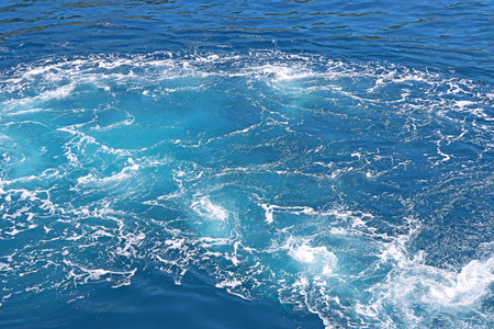 Blue Seawater with sea foam as backgroundの写真素材