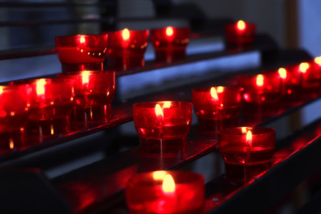 Many burning candles in the churchの写真素材