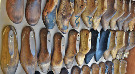 Multiple rows of colorful wooden shoe inserts make a nice interior decoration itemの写真素材