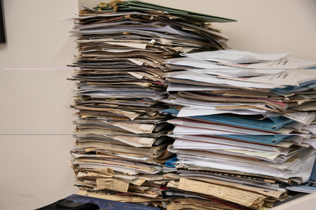 A pile of papers and filesの写真素材