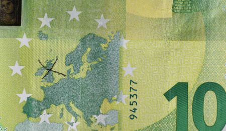 Close up of Euro coin and paper bill showing Brexitの写真素材