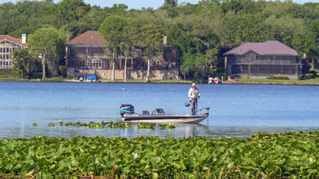 Fishing on a little boat in Lake Tarpon, FLのeditorial素材