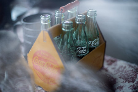 Six pack of vintage coca cola bottles