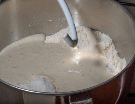 Mixing Sourdough starter yeast sponge to make bread