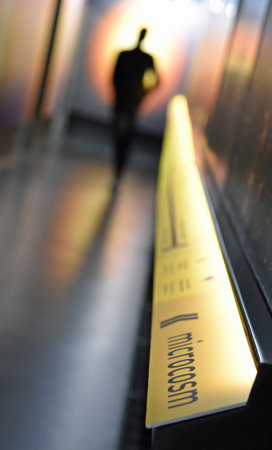 November, 2022, Geneva, Switzerland - Abstract photo of a man walking in CERNs Microcosm exhibitionのeditorial素材