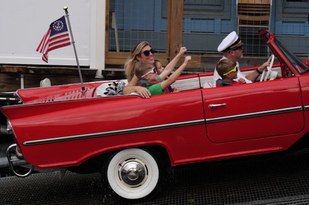 Disney Springs, Orlando, FL, USA - families are having fun with vintage themed amphibian carsのeditorial素材