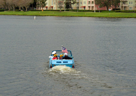 Disney Springs, Orlando, FL, USA - families are having fun with vintage themed amphibian carsのeditorial素材
